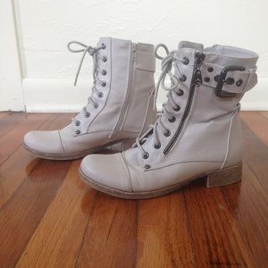 white combat boots with buckle and zipper detail